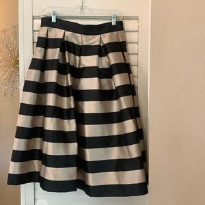 White House Black Market flare black/ champagne colored skirt. Size 6
